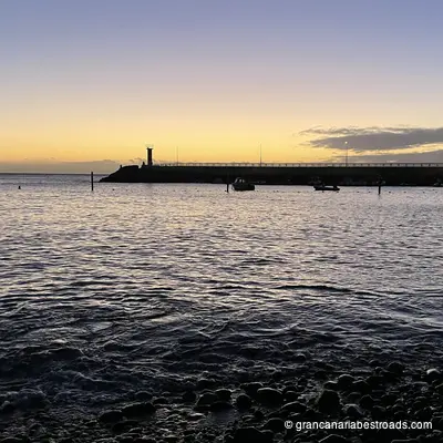 The beach and pier at La Aldea, with Tenerife in the background