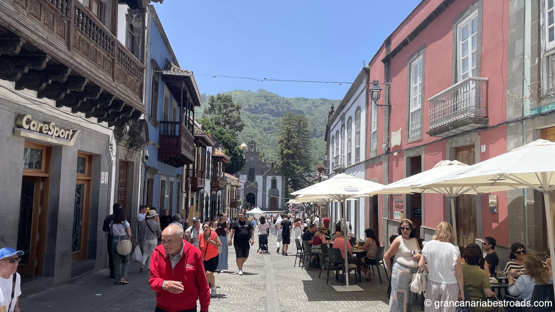 The main street leading to the square, and its traditional shops